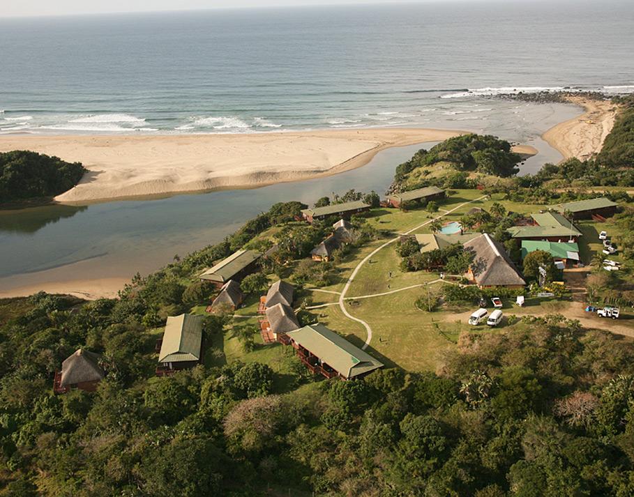 Aerial view of Mbotyi River Lodge along the beach.