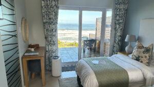A double room at Mes Amis Guesthouse with direct ocean views and a private terrace, Wilderness.