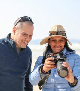 Couple admiring a photo they took on a photo safari in South Africa.