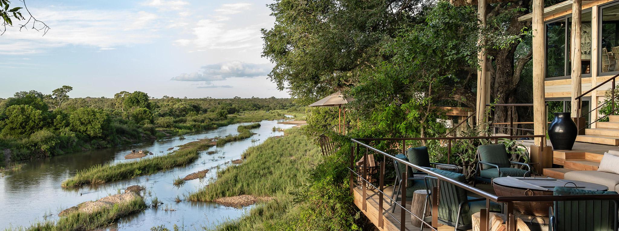 A viewing deck at Singita Ebony Lodge overlooking a river. A popular lodge on different kinds of South Africa tours.