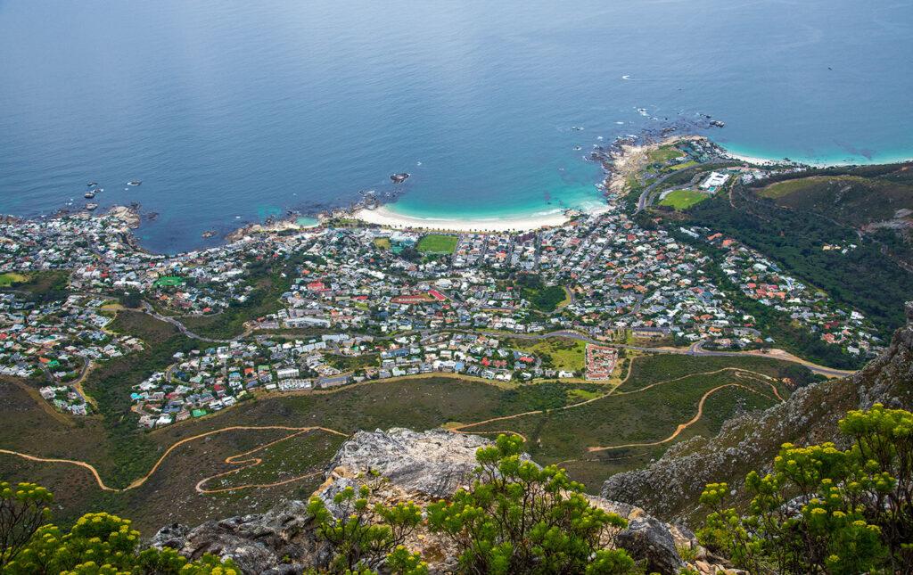 Aerial view of Camps Bay beach and suburb from the top of Table Mountain.