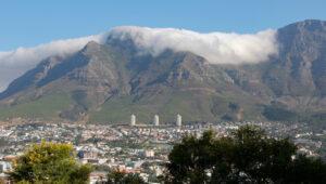 Table Mountain capped with a rolling cloud blanket above Cape Town.