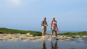 Two guests on a scenic coastal walk on the Wild Coast.