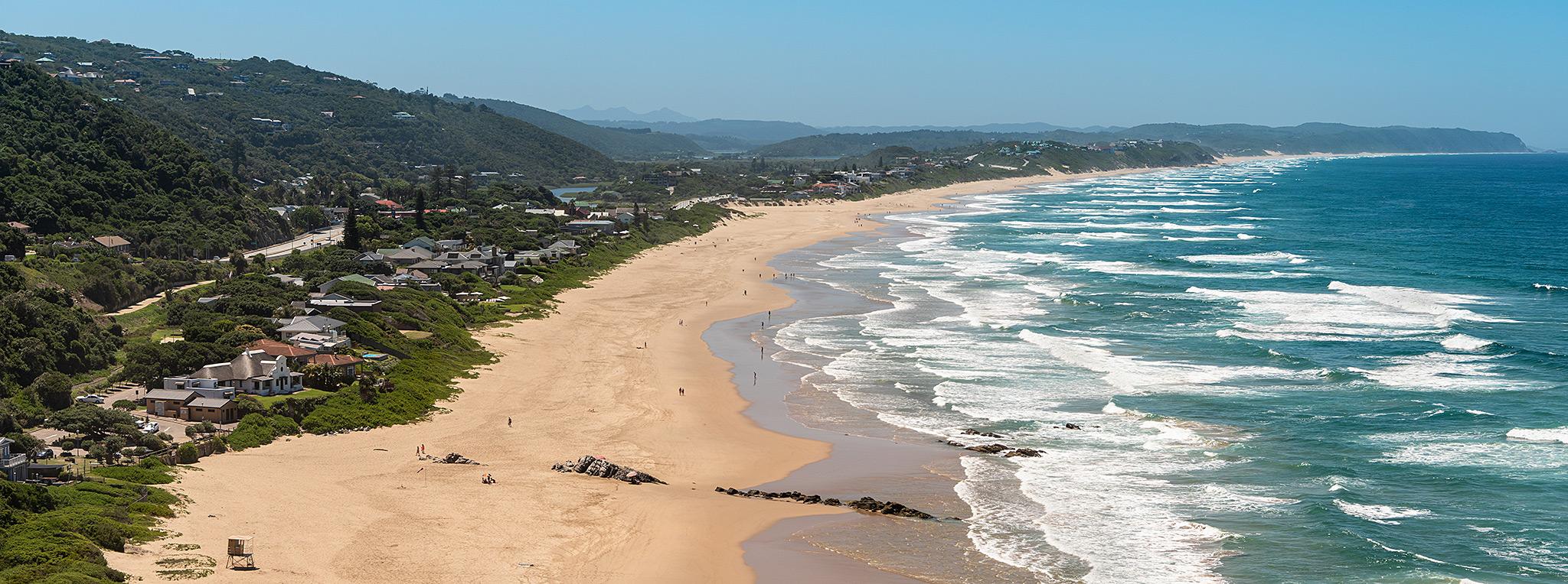 Vast, long, white sandy wild beach.