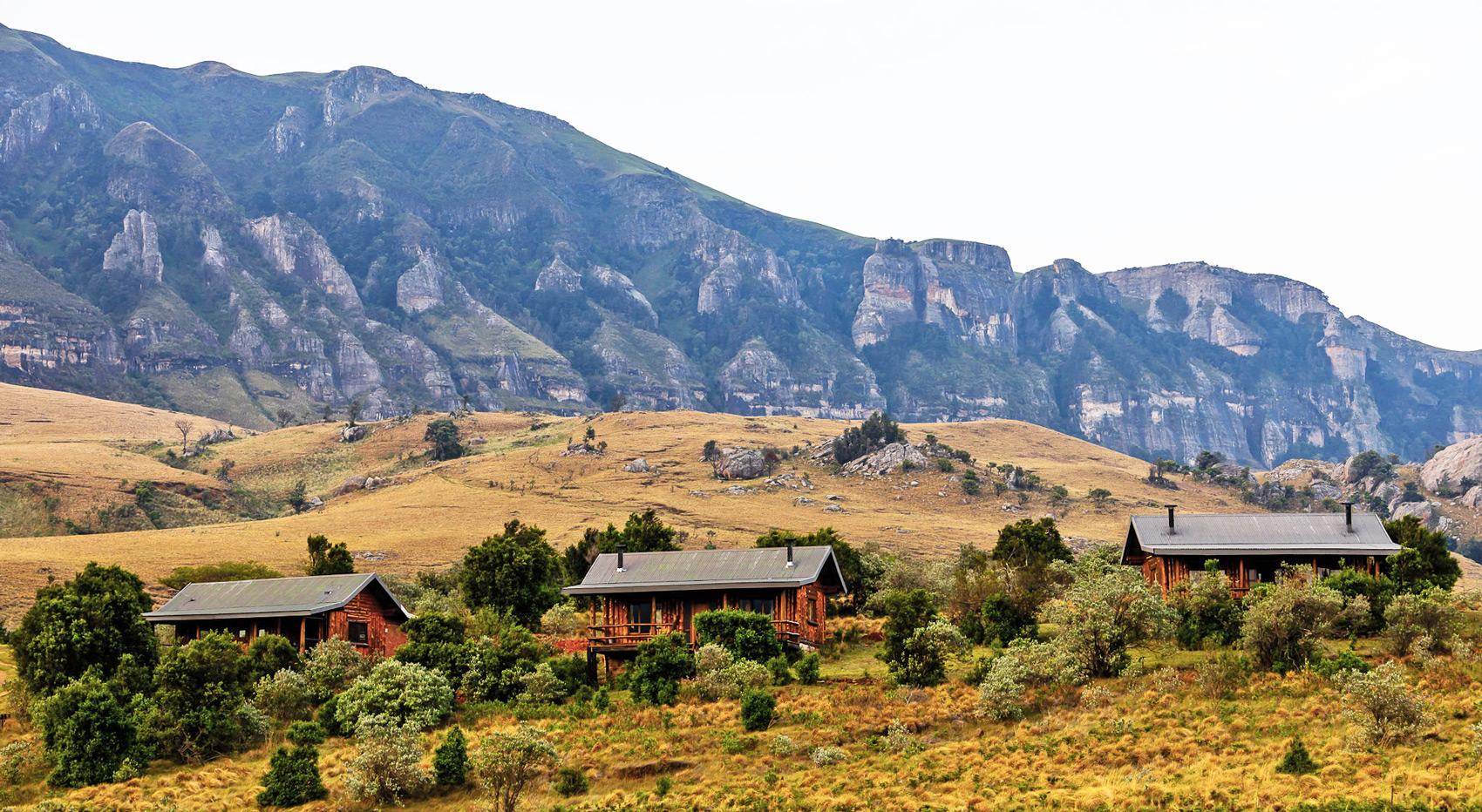 Cozy wooden lodges nestled in the foothills of the Drakensberg Mountains, South Africa. Cozy wooden lodges nestled in the foothills of the Drakensberg Mountains, South Africa.