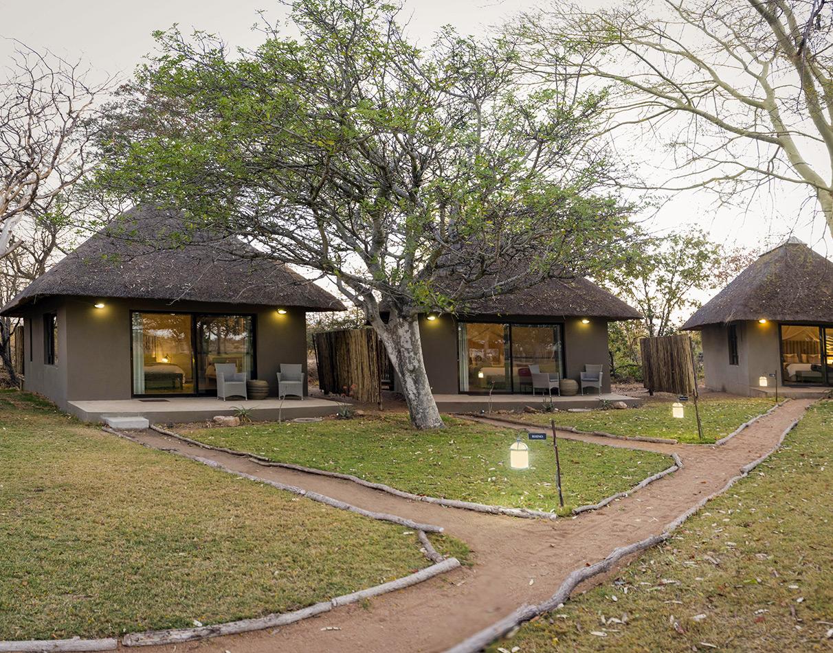 Thatched-roof bungalows at Xanatseni Private Camp