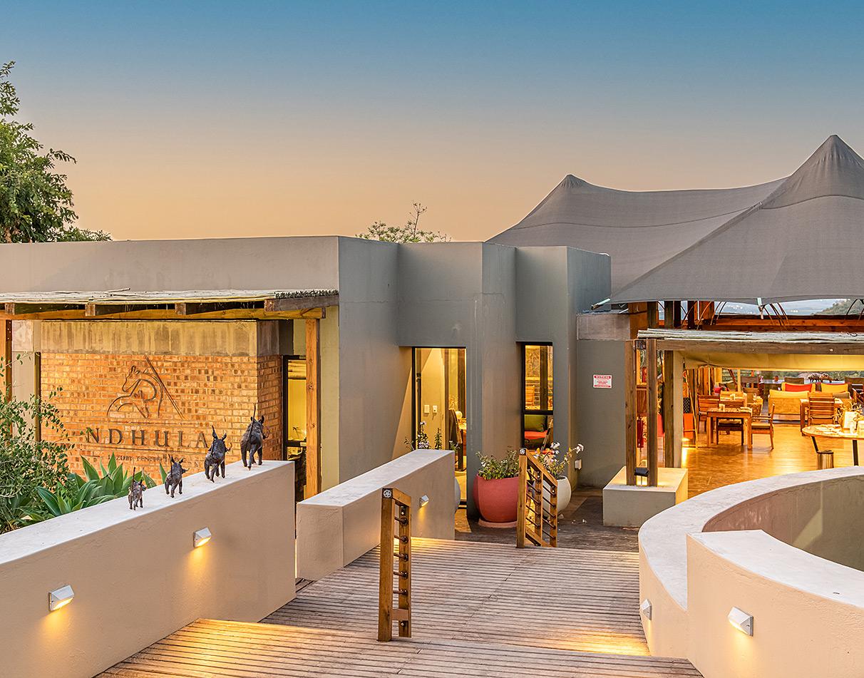 Ndhula Luxury Tented Lodge entrance with sculptures